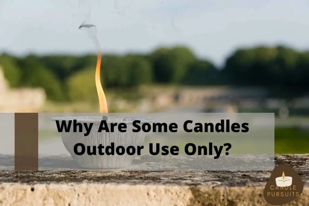 Burning outdoors candle